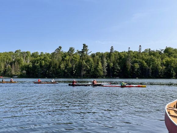 Canoeist and kayakers paddling on Trout Lake